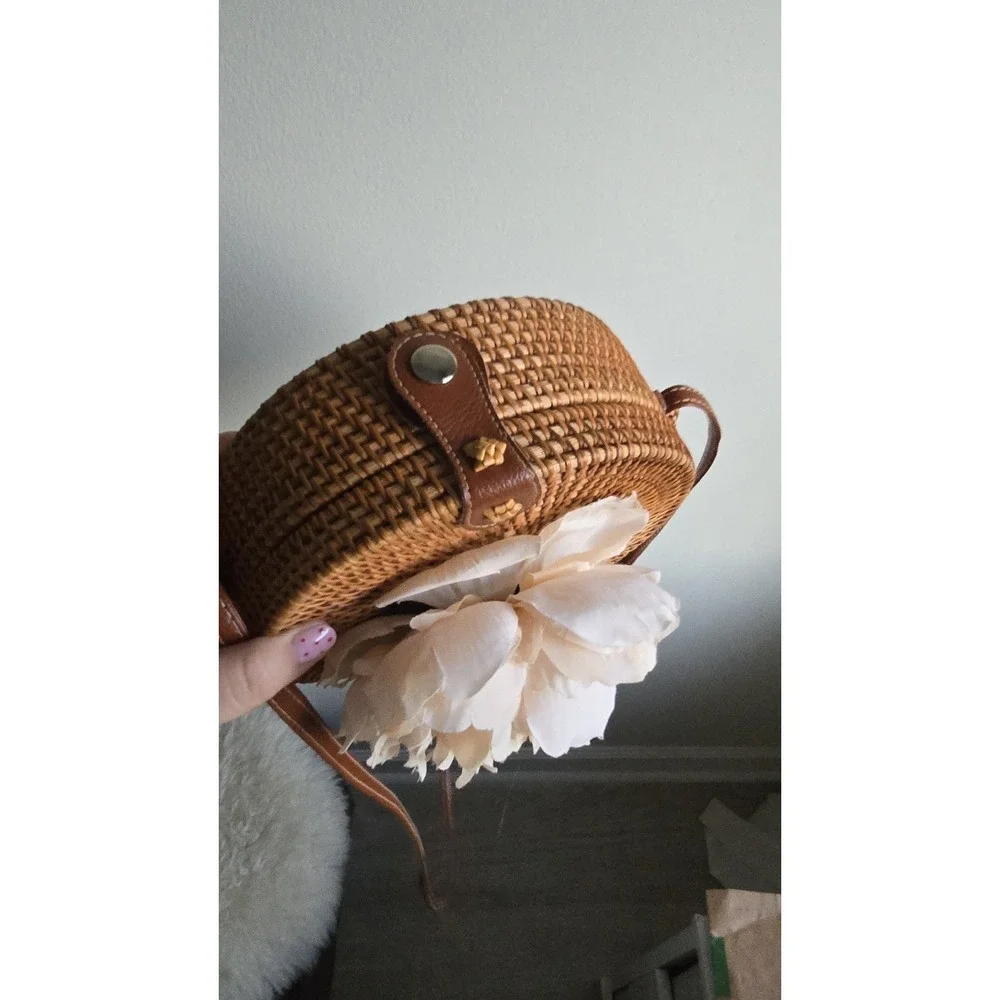 Handwoven round rattan Bali crossbody bag with straps & decorated with‎ flowers